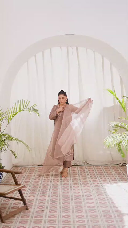 Woman wearing brown embroidered organze shalwar kameez suit video